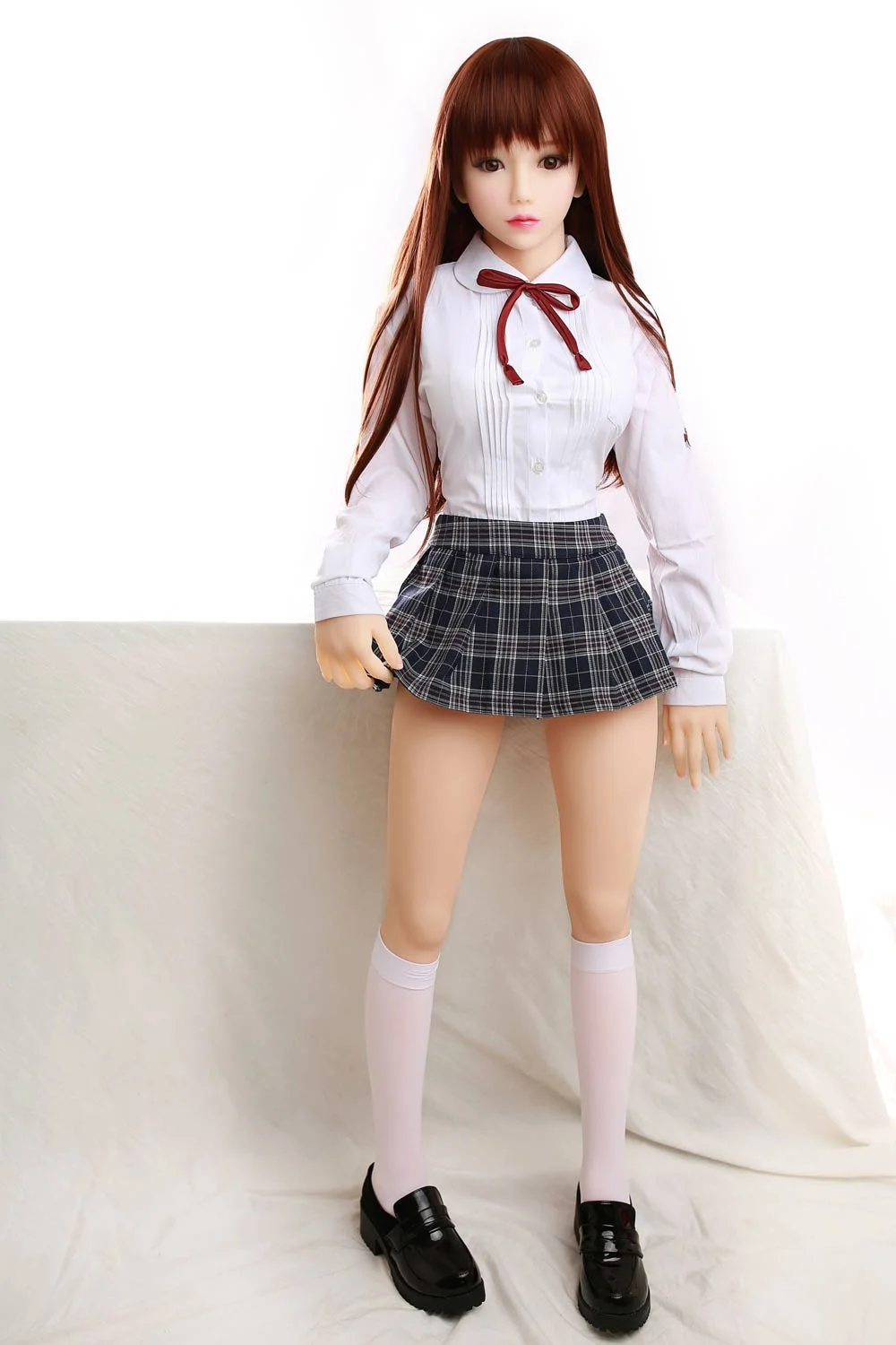 Mini sex doll with pleated skirt
