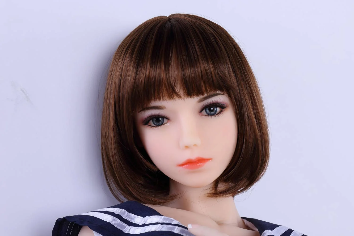 Mini sex doll with short brown hair