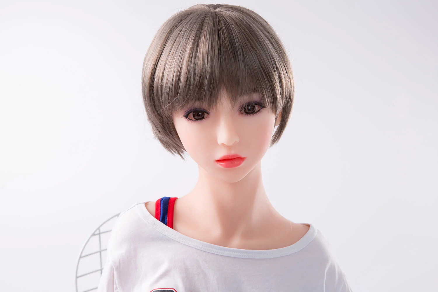 Mini sex doll with short gray hair