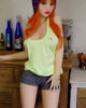 Sex doll with hand on thigh