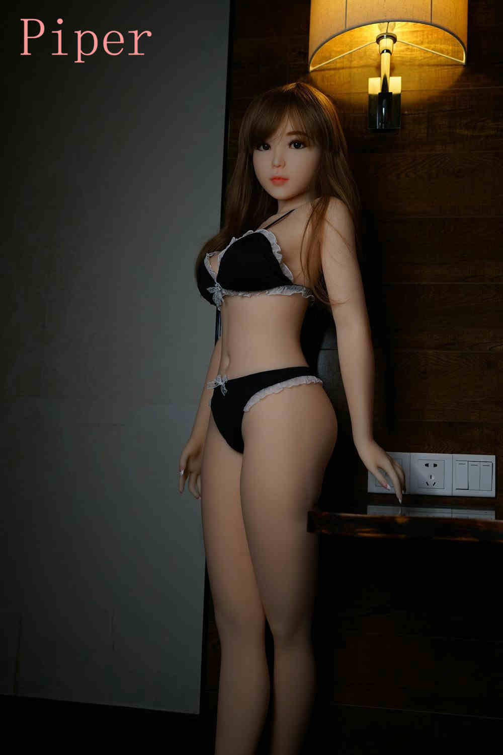 Sex doll with hands on the table