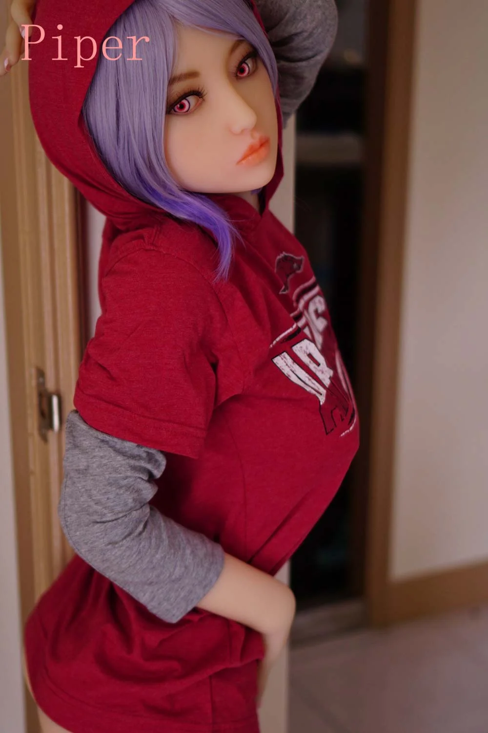 Sex doll with hands touching belly