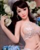 Sex doll with hands touching belly