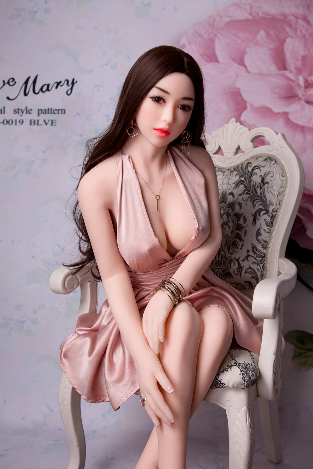 Sex doll with hands touching calves