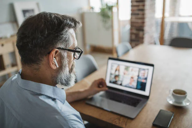 Mature men at home during pandemic isolation have conference call