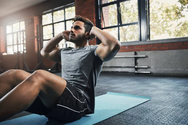 Shot of a handsome young man working out at the gym