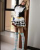 Anime sex doll leaning on the door frame