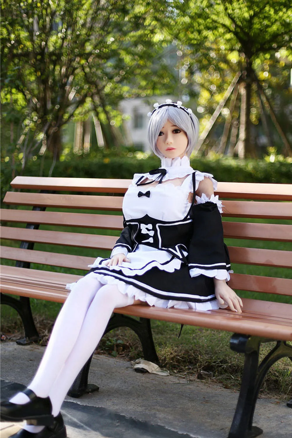 Anime sex doll sitting on a bench