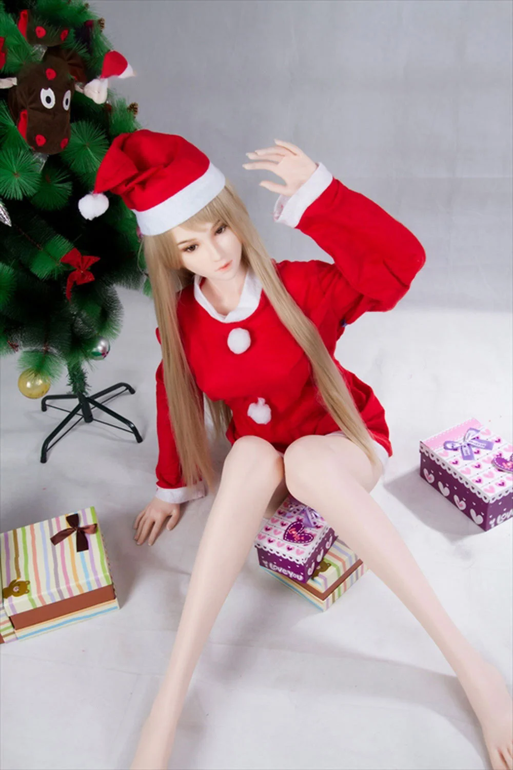 Anime sex doll wearing Christmas hat