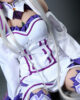 Anime sex doll wearing a green gemstone necklace