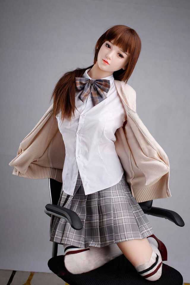 Anime sex doll with legs kneeling on a chair