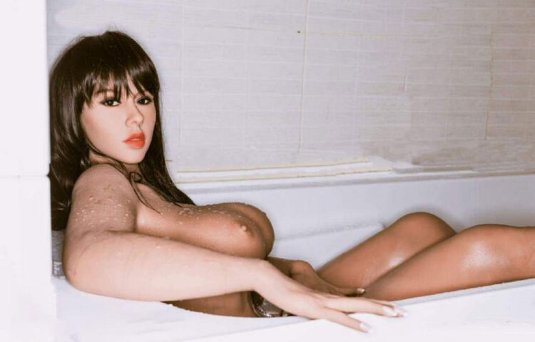BBW sex doll lying in the bathtub with hands on it