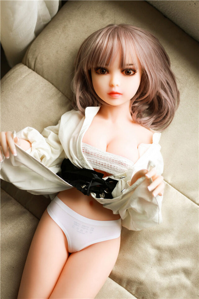 A mini sex doll that pulls up the corners of her clothes to reveal her underwear