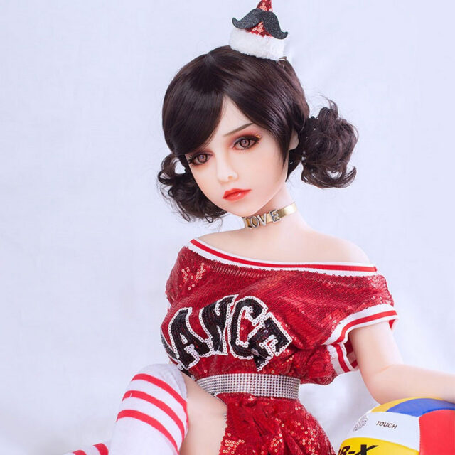 A mini sex doll with a neckband around the neck