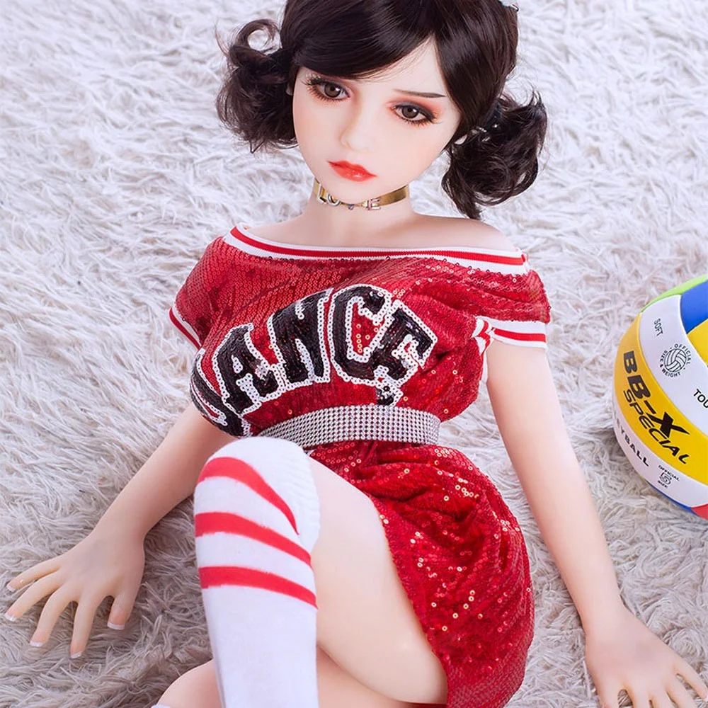 Mini sex doll lying on the ground with hands on top