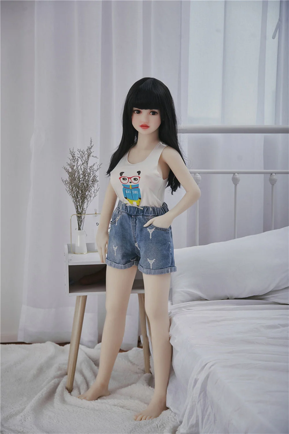 Mini sex doll standing with hands in pockets