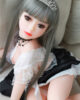Mini sex doll wearing a crown