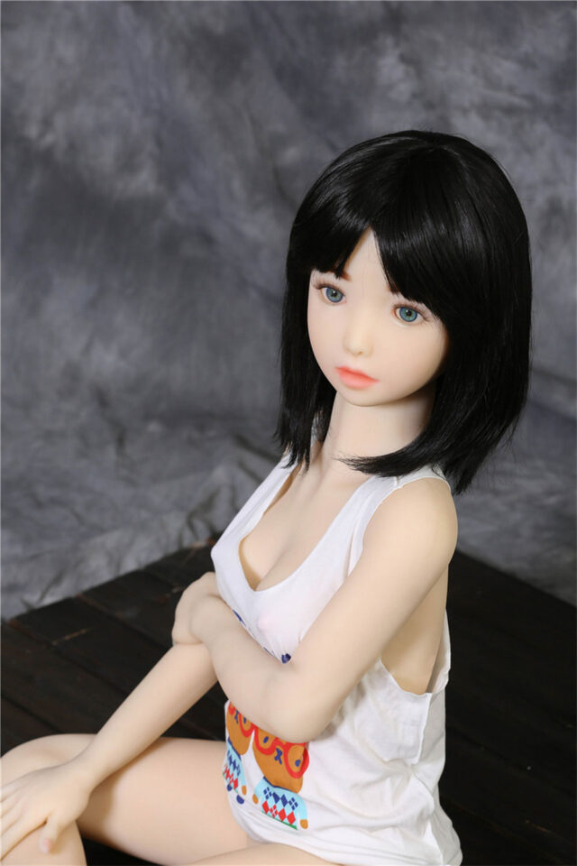 Mini sex doll with hands on knees