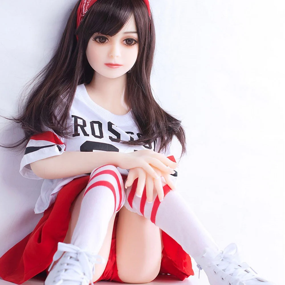 Mini sex doll with legs bent and hands on knees