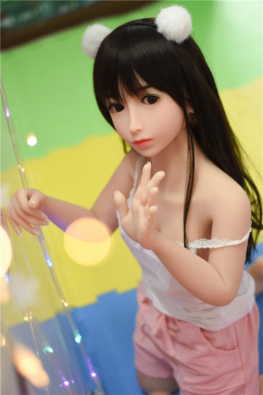 Sex doll holding a pipe in hand