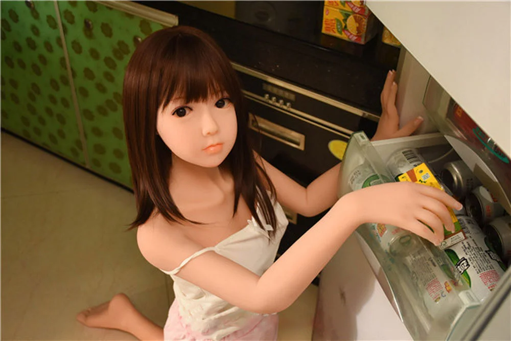 Sex doll kneeling on the ground and holding hands in the refrigerator