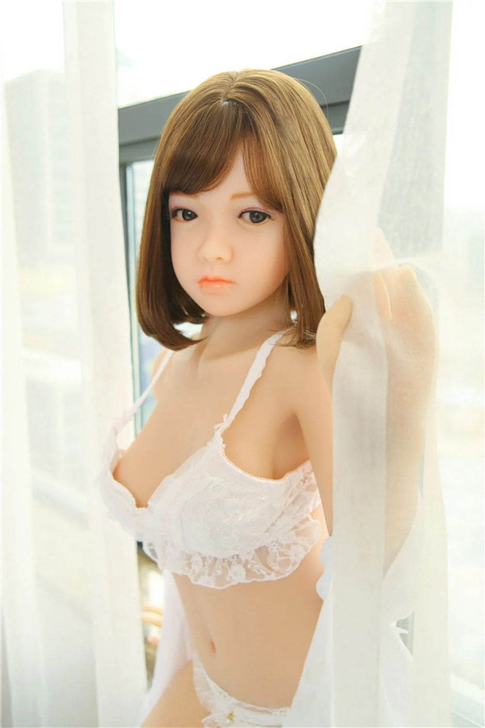 Sex doll with hand touching curtain