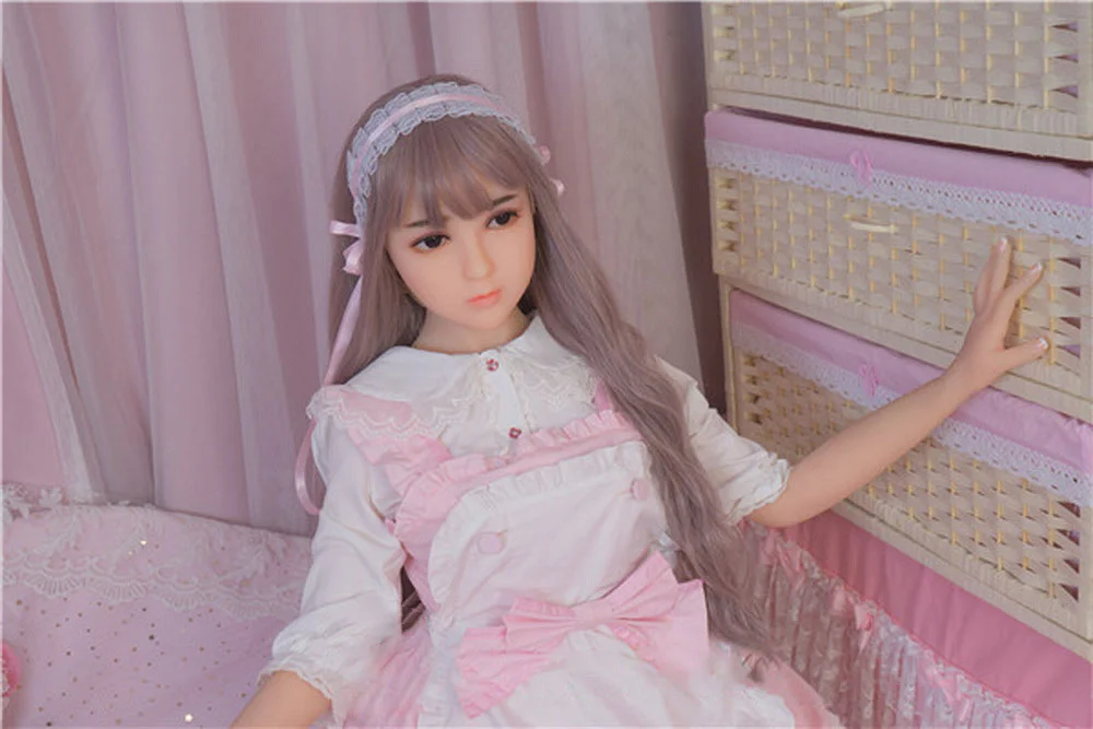 Sex doll with hands on the wall