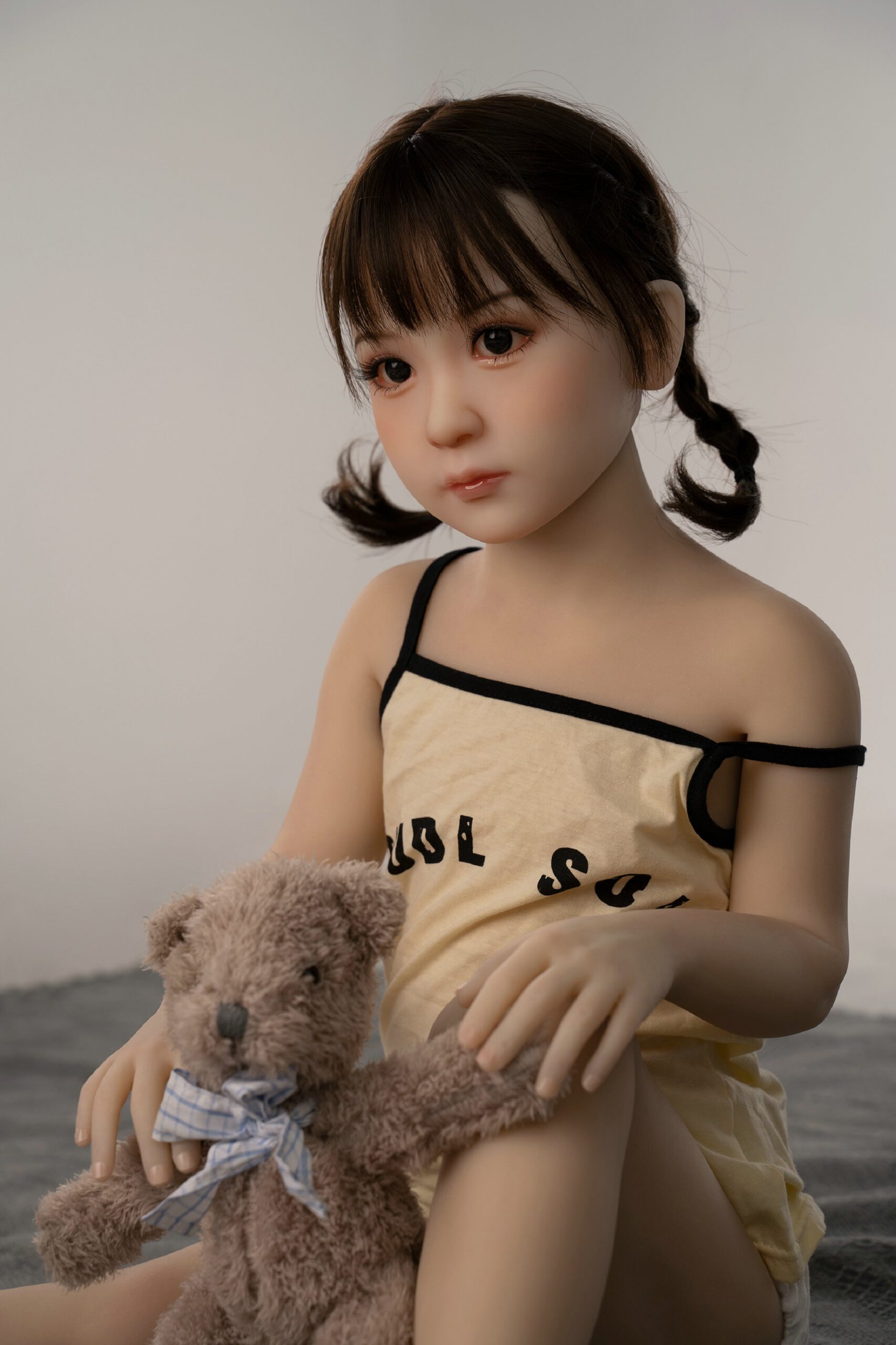 young girl tpe sex doll playing with bear